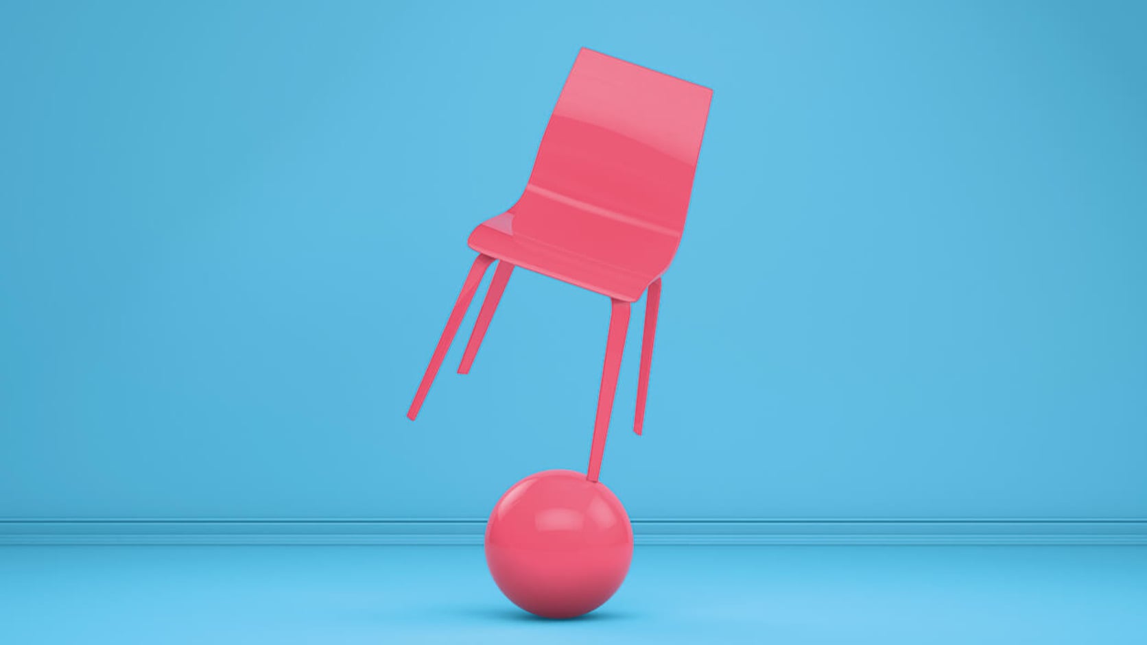 Pinkfarbener Stuhl auf einer Kugel als Sinnbild für Balance und Veränderung im Coaching.